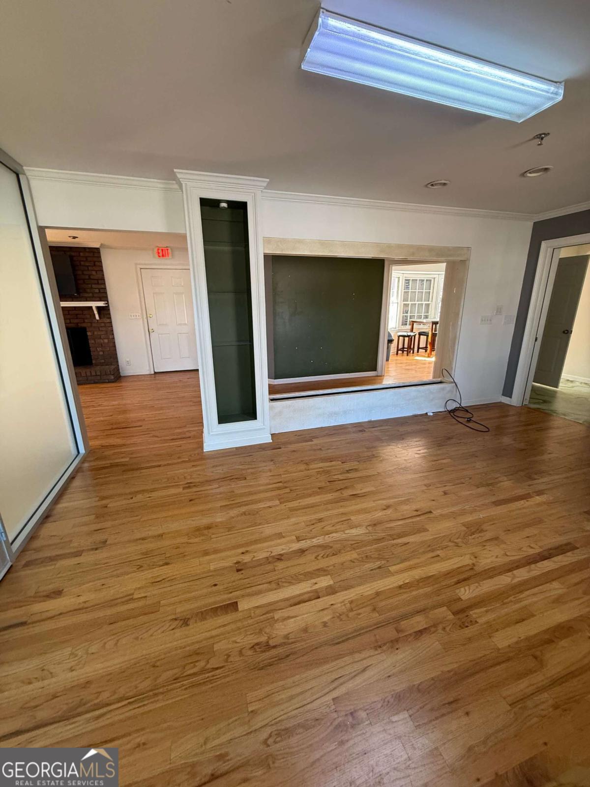 1001 Oak Road Southwest, Unit 1 Lilburn, GA 30047 - Photo 2 of 12 a view of an empty room with wooden floor and a window