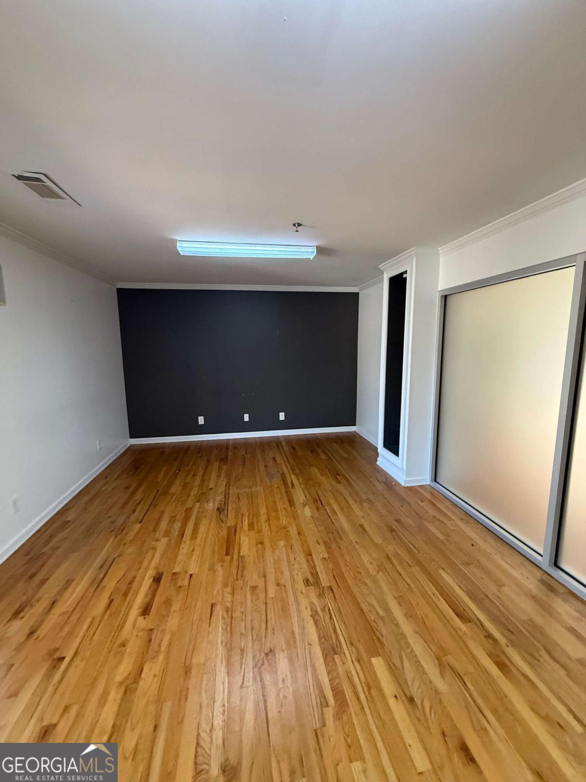 1001 Oak Road Southwest, Unit 1 Lilburn, GA 30047 - Photo 5 of 12 a view of a room with wooden floor
