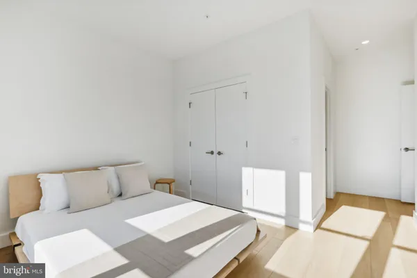 a bedroom with a bed and a couch