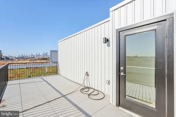 a view of a balcony with wooden floor