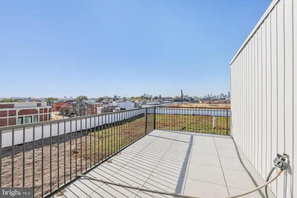 a view of a balcony with city view
