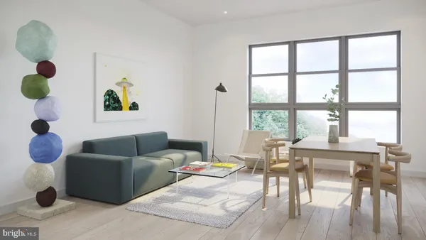 a workspace with furniture and a large window