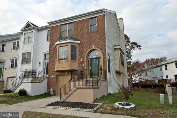 2247 Conquest Way, Unit 63 Odenton, MD 21113 - Photo 1 of 30 a front view of a house with garden