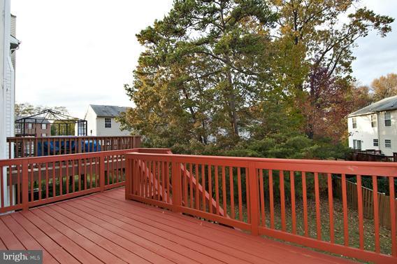 2247 Conquest Way, Unit 63 Odenton, MD 21113 - Photo 12 of 30 a view of balcony with wooden floor