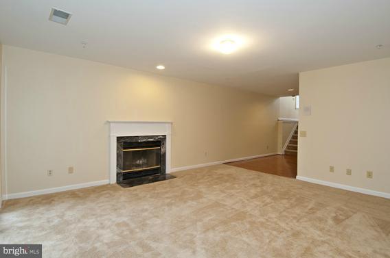 2247 Conquest Way, Unit 63 Odenton, MD 21113 - Photo 15 of 30 a view of empty room with a fireplace
