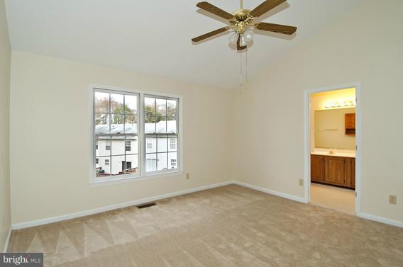 2247 Conquest Way, Unit 63 Odenton, MD 21113 - Photo 17 of 30 an empty room with windows and fan