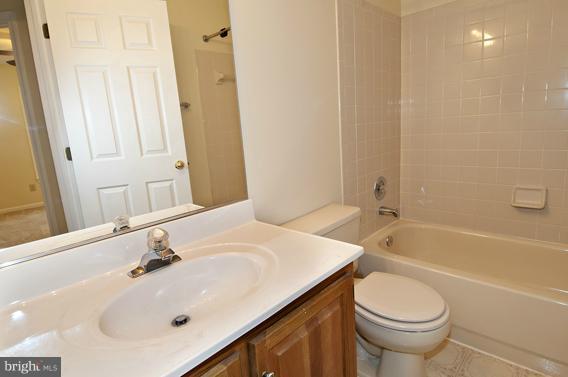 2247 Conquest Way, Unit 63 Odenton, MD 21113 - Photo 20 of 30 a bathroom with a sink and a toilet