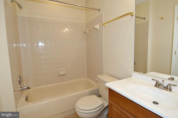 2247 Conquest Way, Unit 63 Odenton, MD 21113 - Photo 23 of 30 a bathroom with a sink toilet and shower