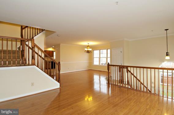 2247 Conquest Way, Unit 63 Odenton, MD 21113 - Photo 6 of 30 a view of an entryway with wooden floor