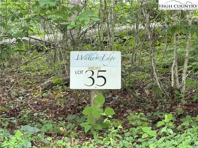 a sign that is sitting on a wooden wall