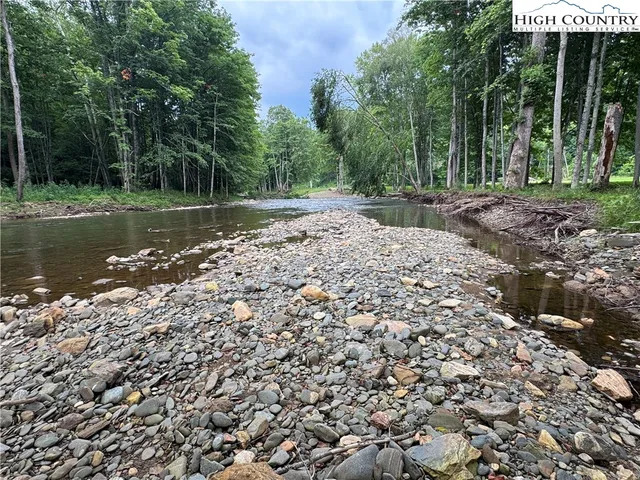 a view of outdoor space with trees all around