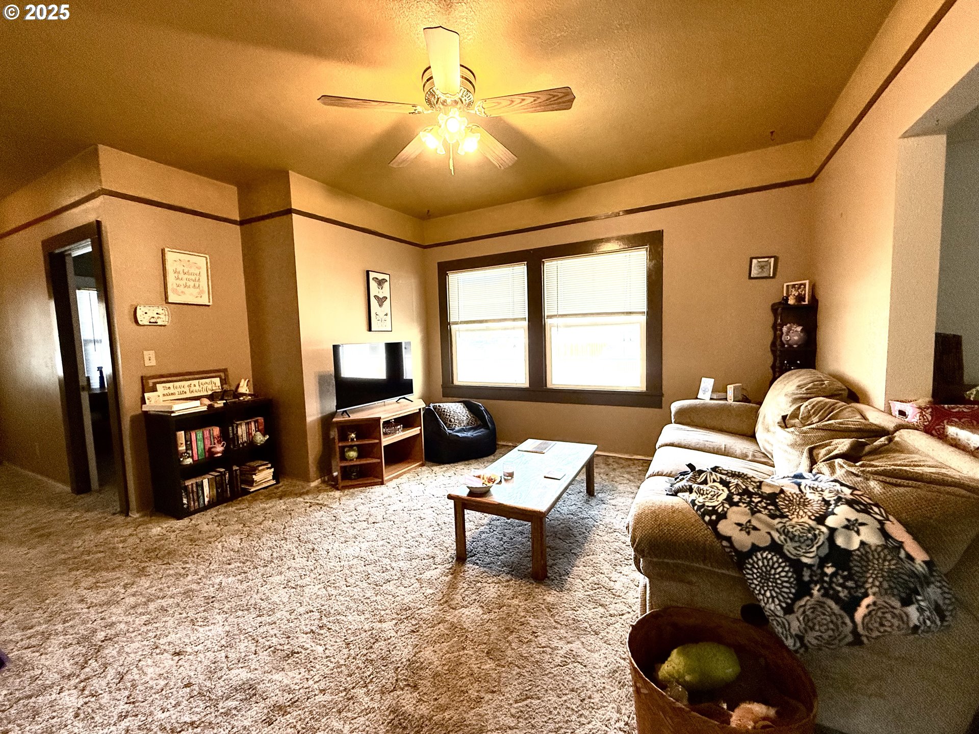222 West Court Street Goldendale, WA 98620 - Photo 11 of 19 a living room with furniture and a chandelier