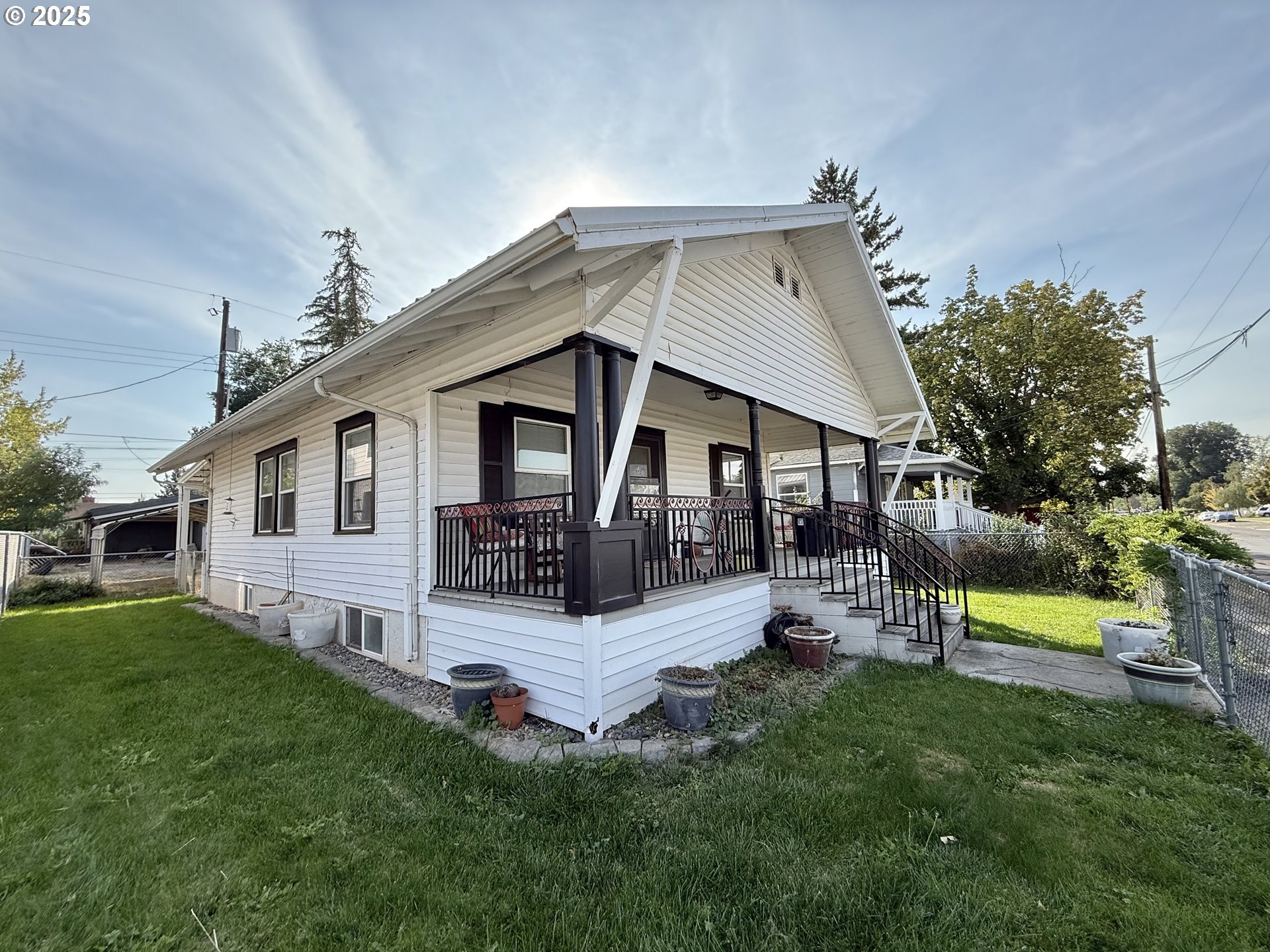 222 West Court Street Goldendale, WA 98620 - Photo 2 of 19 a view of a house with a yard porch and sitting area