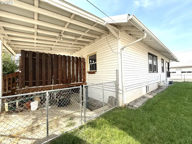 a view of backyard with cabin