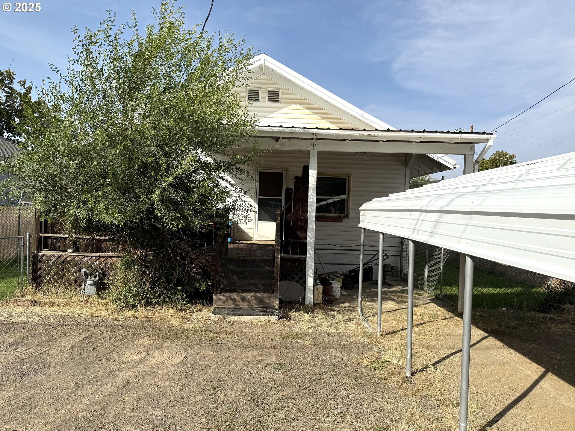 222 West Court Street Goldendale, WA 98620 - Photo 5 of 19 a view of a house with a patio and a yard