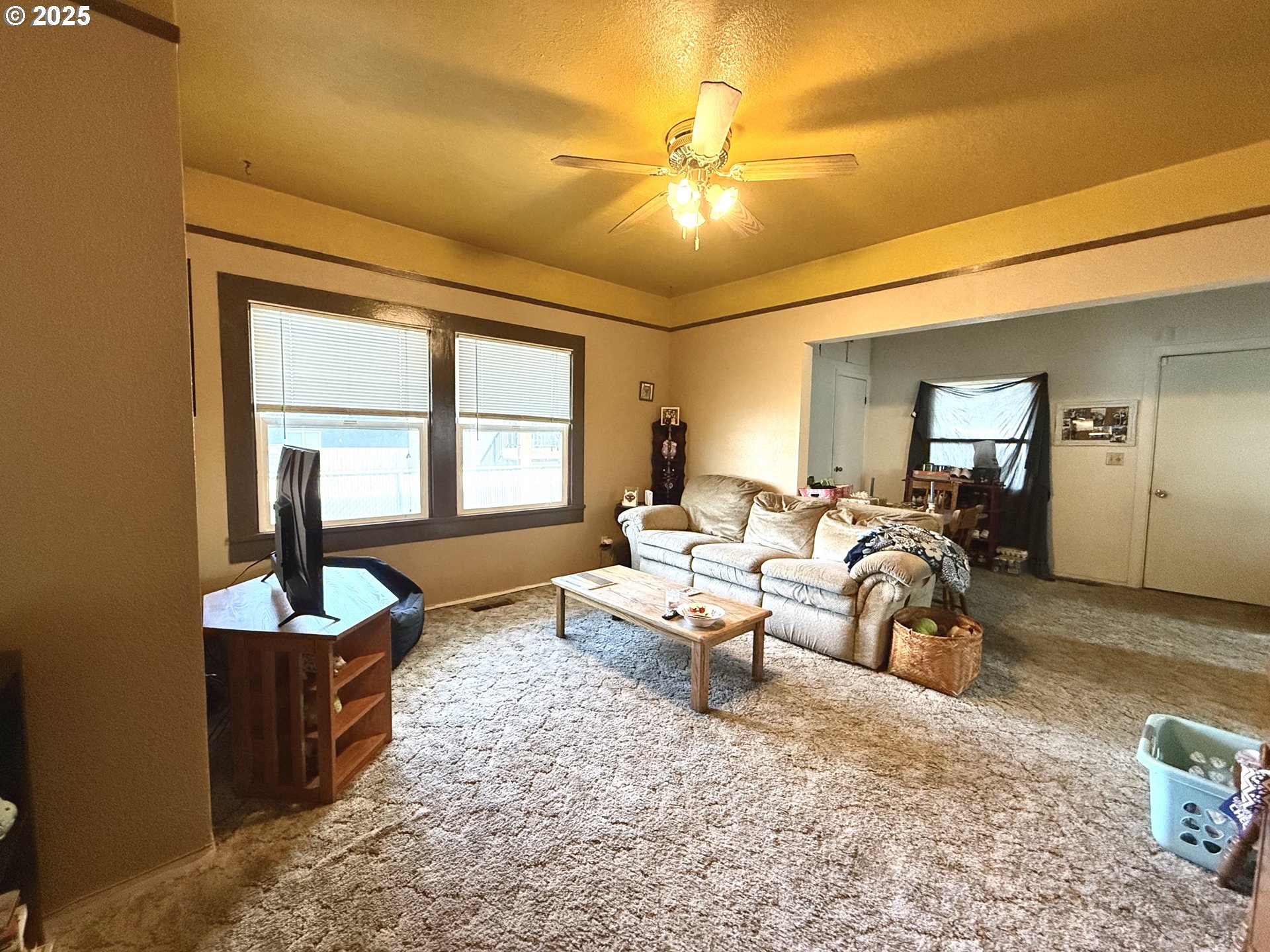222 West Court Street Goldendale, WA 98620 - Photo 10 of 19 a living room with furniture and a large mirror