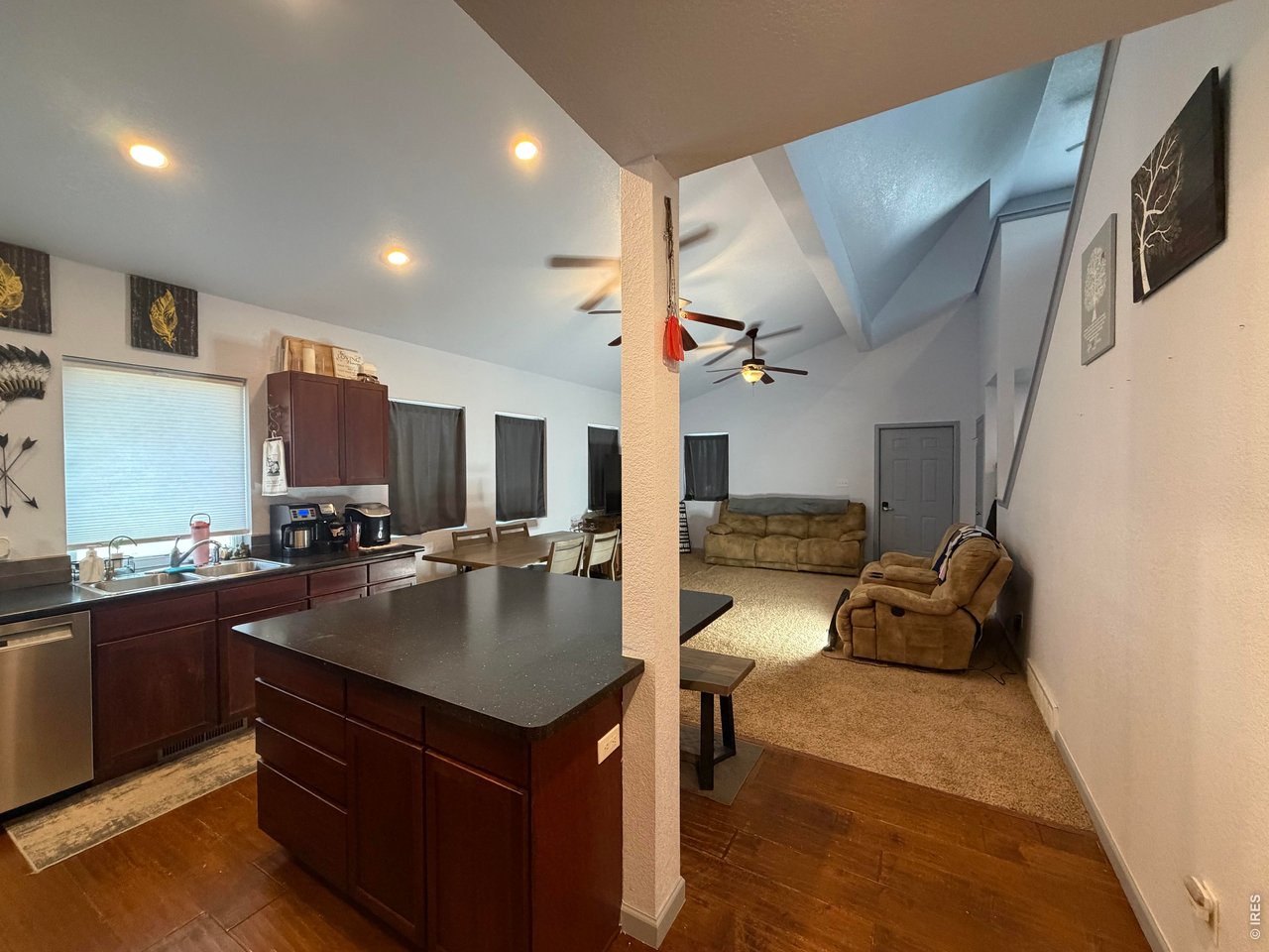 401 Church Street Kit Carson, CO 80825 - Photo 11 of 31 a kitchen with stainless steel appliances granite countertop a sink and a refrigerator