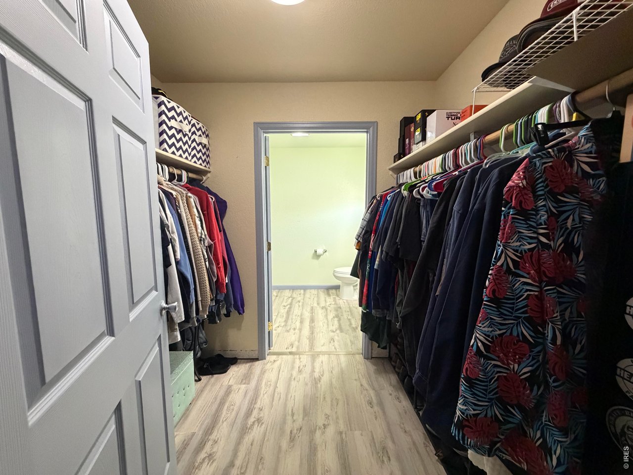 401 Church Street Kit Carson, CO 80825 - Photo 17 of 31 a view of walk in closet with clothes