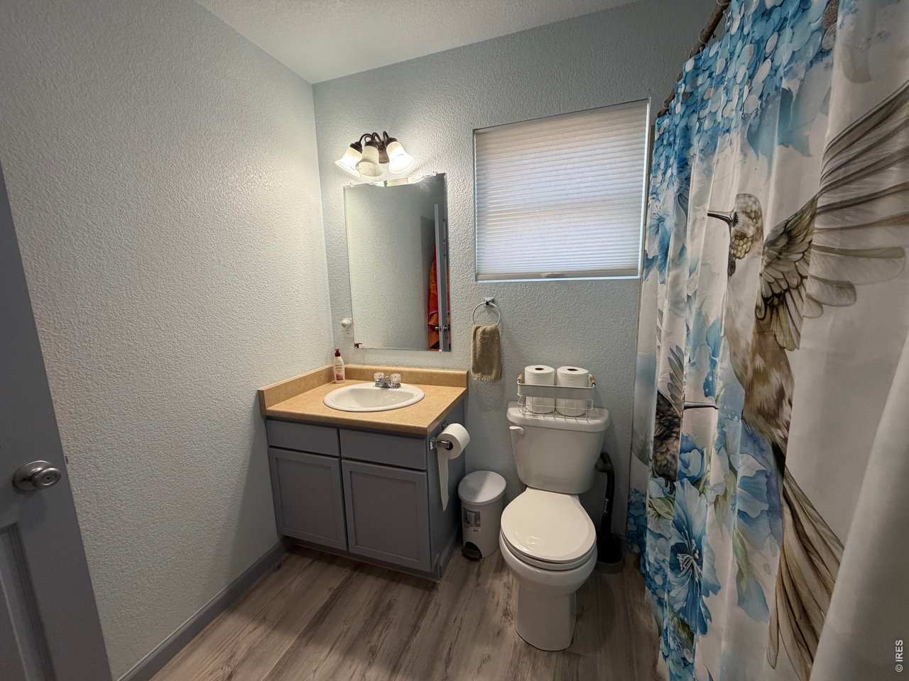 401 Church Street Kit Carson, CO 80825 - Photo 19 of 31 a bathroom with a granite countertop toilet and a sink
