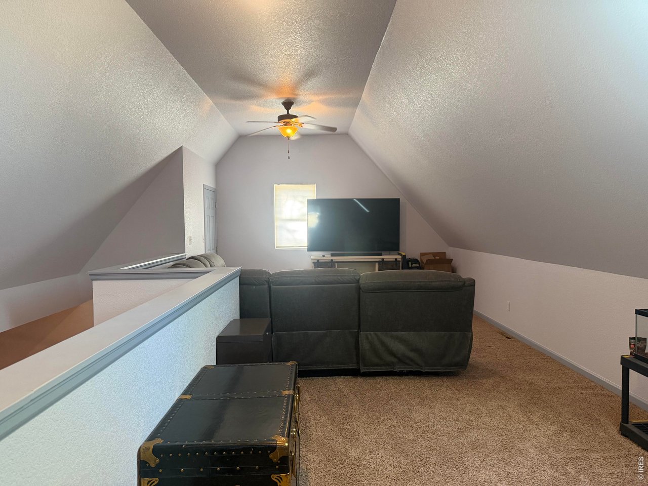401 Church Street Kit Carson, CO 80825 - Photo 23 of 31 a living room with furniture and a flat screen tv