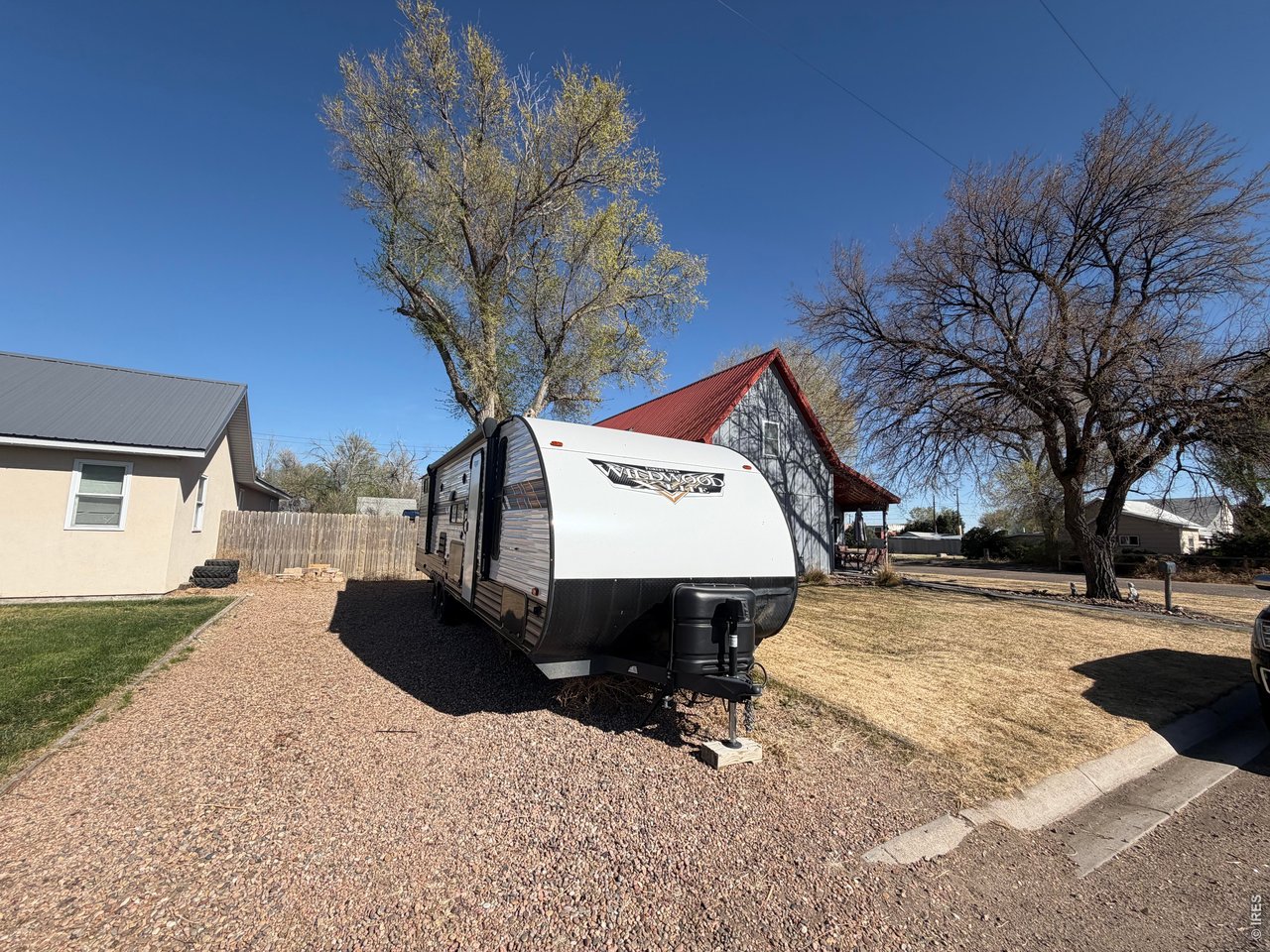 401 Church Street Kit Carson, CO 80825 - Photo 29 of 31 a view of a house with a yard