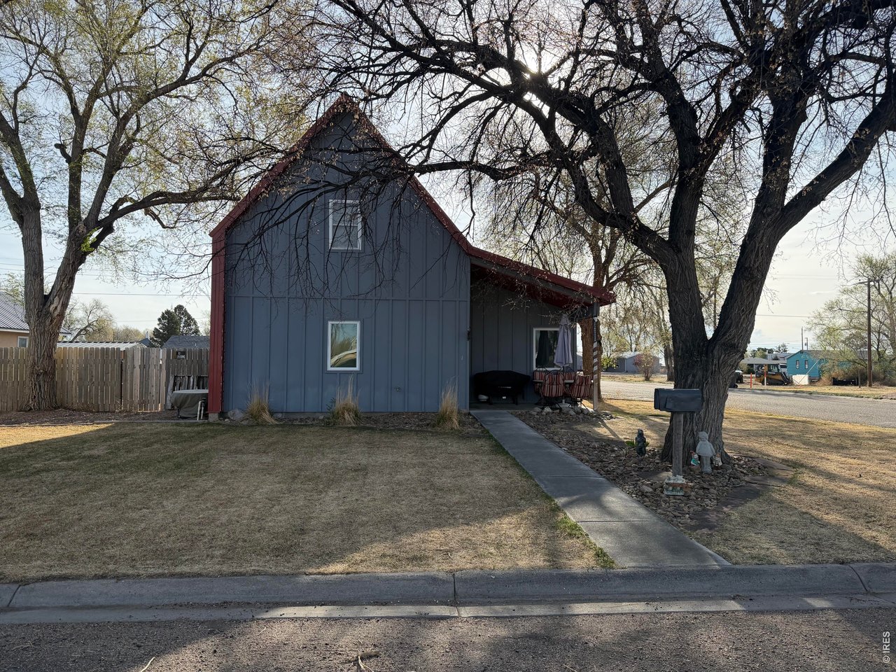401 Church Street Kit Carson, CO 80825 - Photo 30 of 31 a view of a house with a yard covered in snow