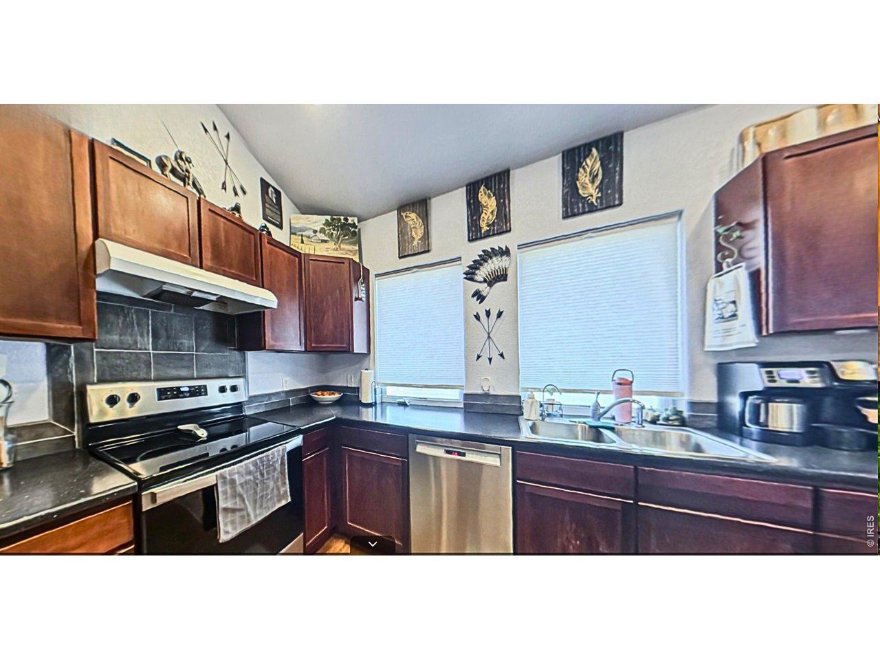 401 Church Street Kit Carson, CO 80825 - Photo 9 of 31 a kitchen with stainless steel appliances granite countertop a sink stove and cabinets