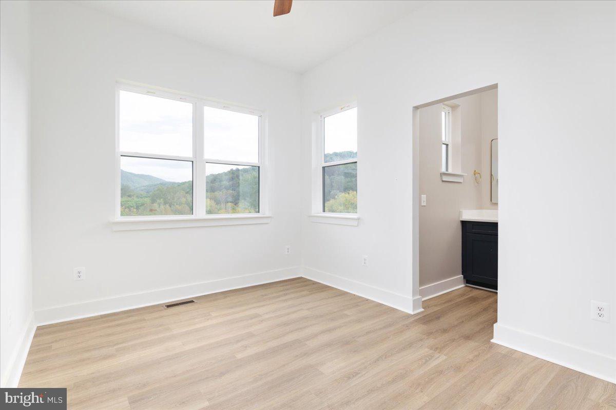 21 Mockingbird Lane Luray, VA 22835 - Photo 27 of 53 an empty room with wooden floor and windows