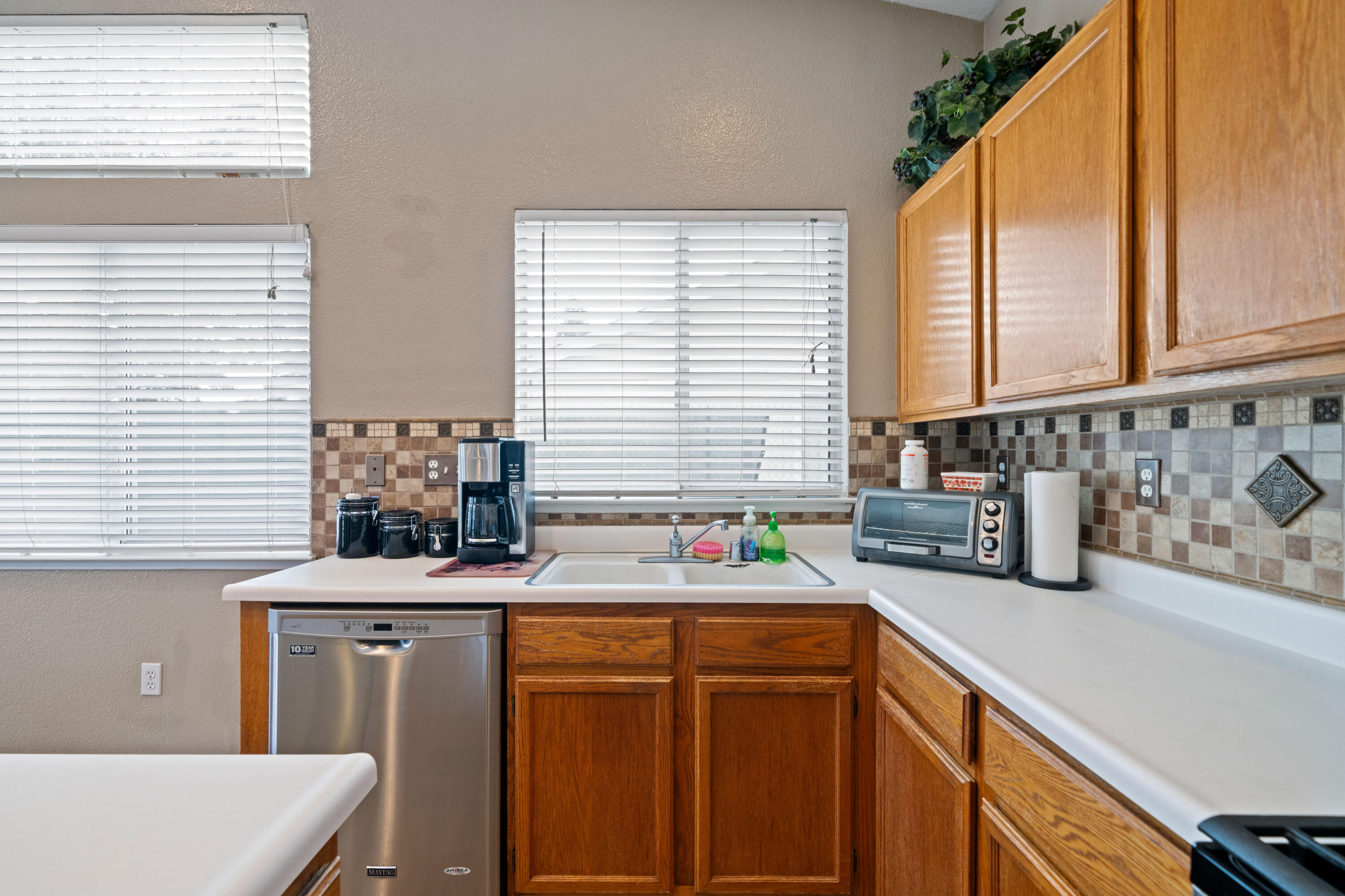 1959 Alexis Court Redding, CA 96002 - Photo 11 of 34 a kitchen with stainless steel appliances a sink window and cabinets