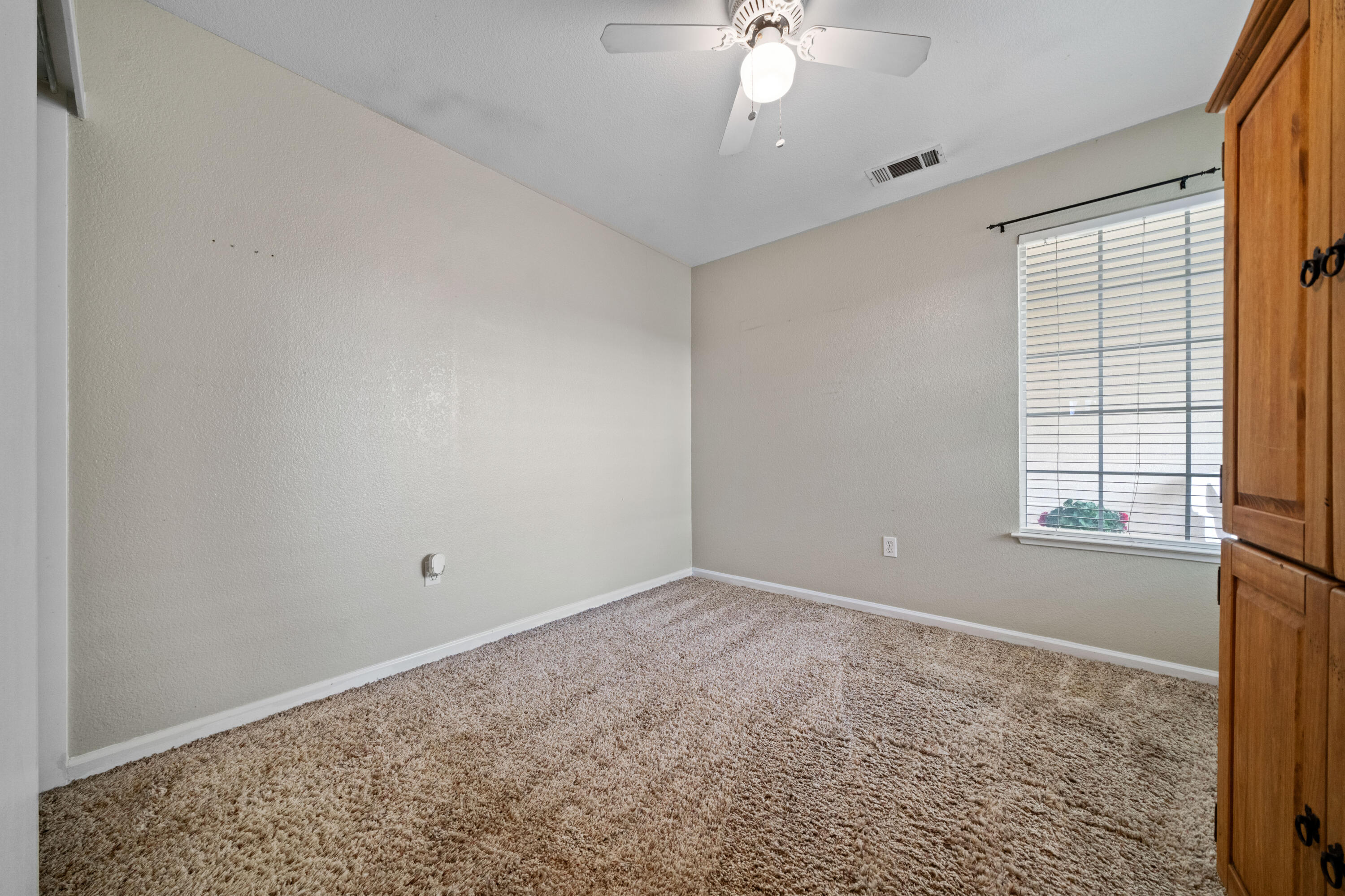 1959 Alexis Court Redding, CA 96002 - Photo 19 of 34 wooden floor in an empty room with a window