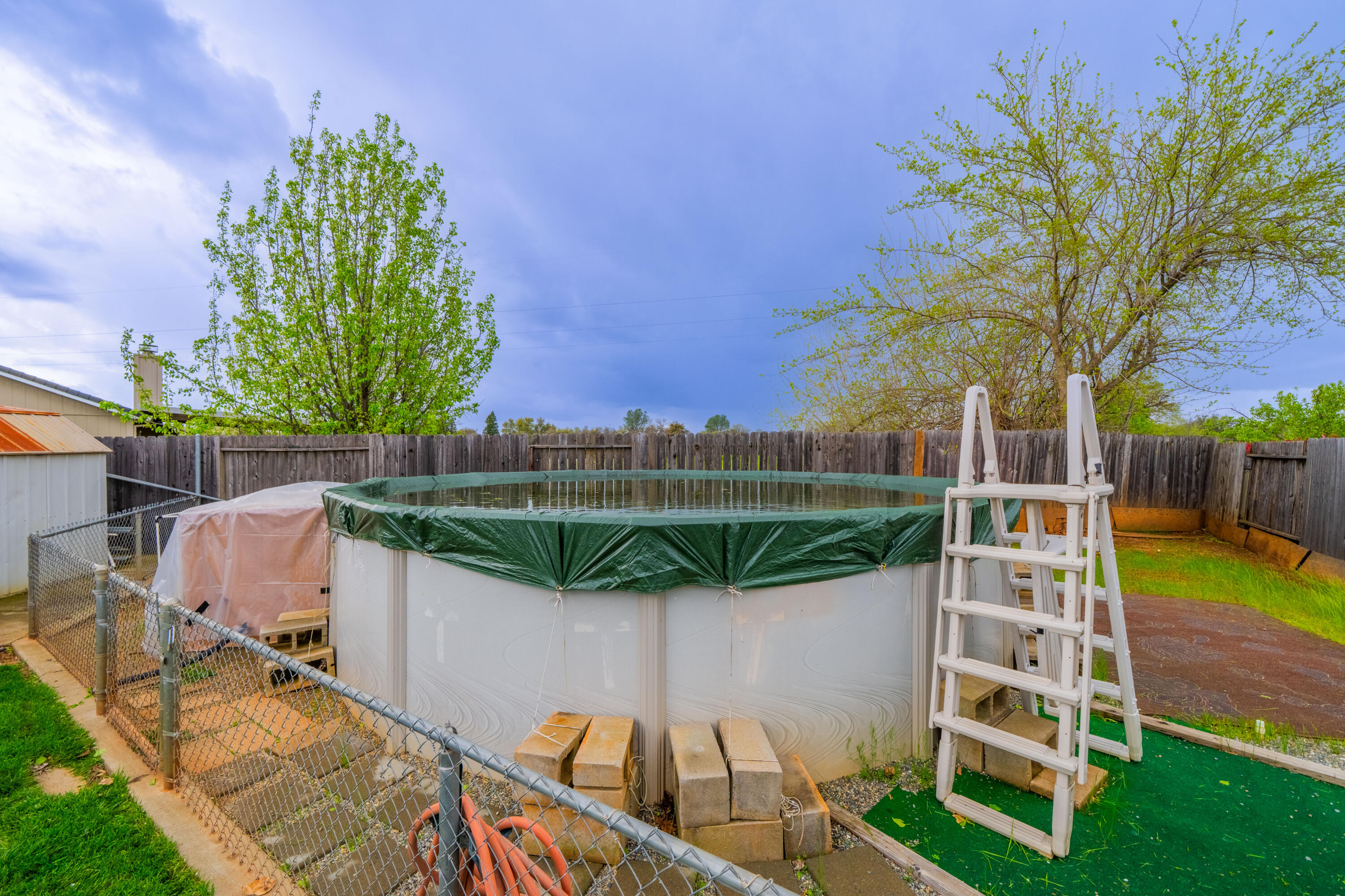 1959 Alexis Court Redding, CA 96002 - Photo 28 of 34 a view of a chairs and table in backyard of the house