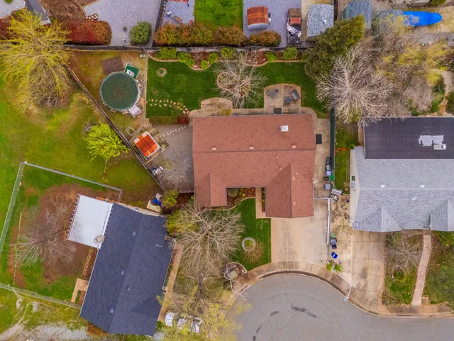 an aerial view of a house with a lake view