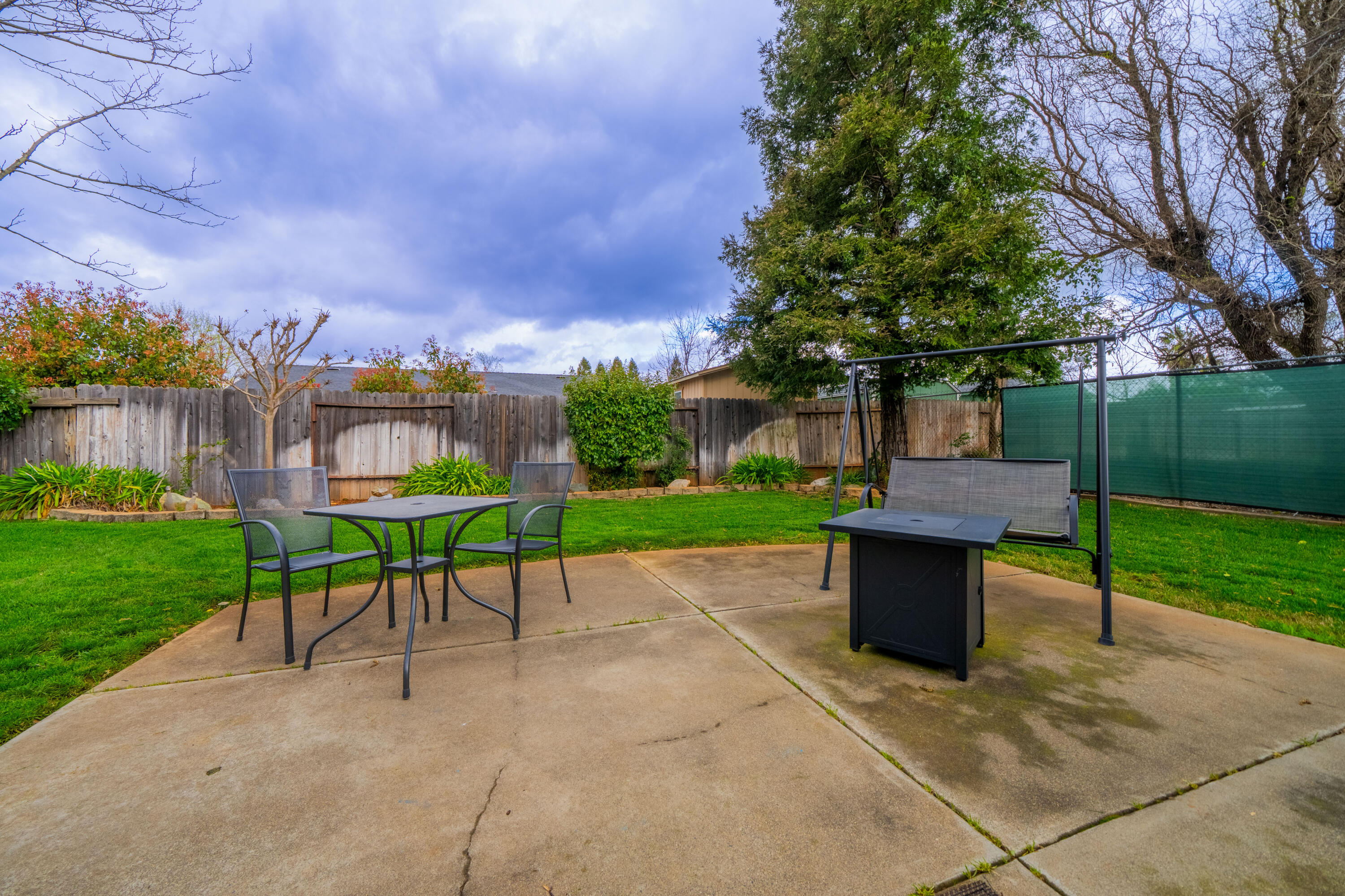 1959 Alexis Court Redding, CA 96002 - Photo 4 of 34 a view of house with backyard and outdoor seating