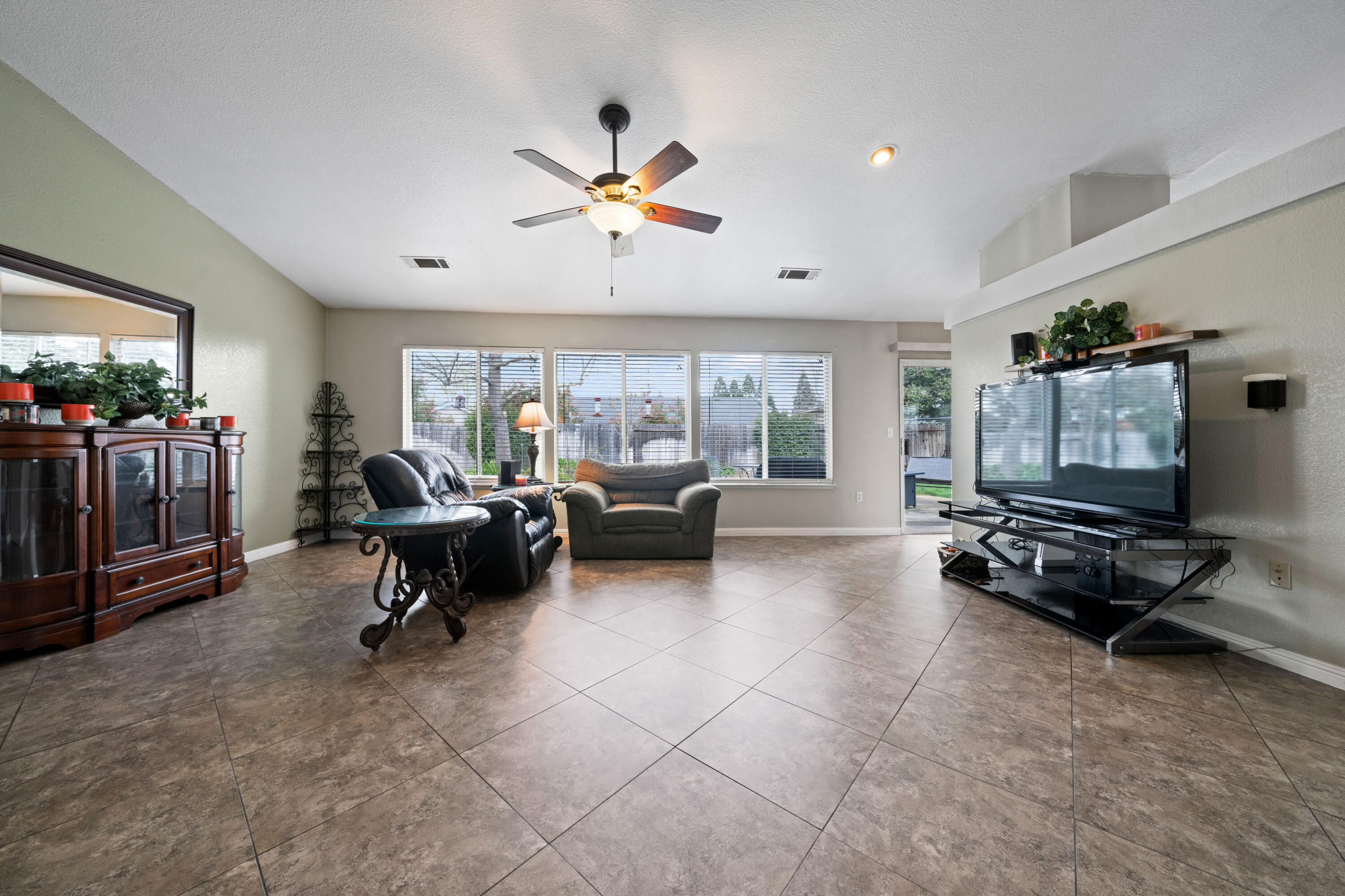 1959 Alexis Court Redding, CA 96002 - Photo 6 of 34 a living room with furniture and a flat screen tv