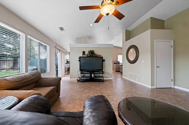 a living room with furniture and a large window