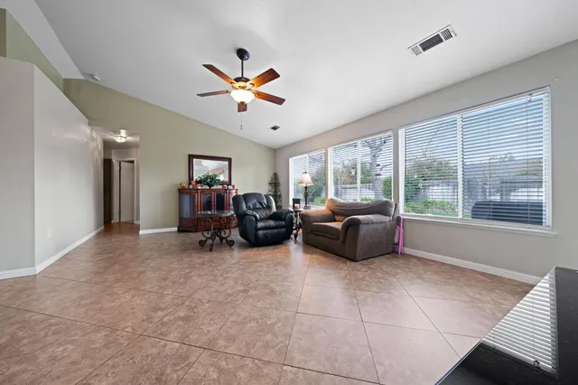 a living room with furniture and a large window