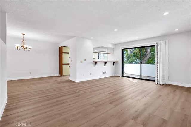 a view of a kitchen with a sink and a window