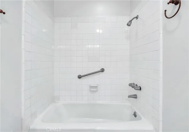 an empty room with wooden floor and window