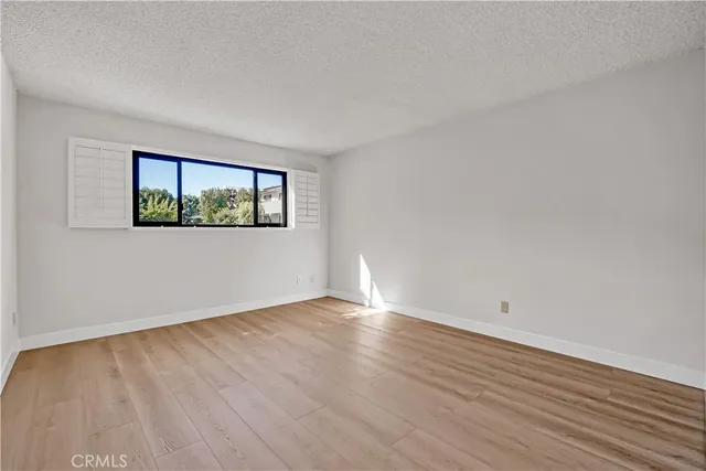 a view of a house with swimming pool and sitting area