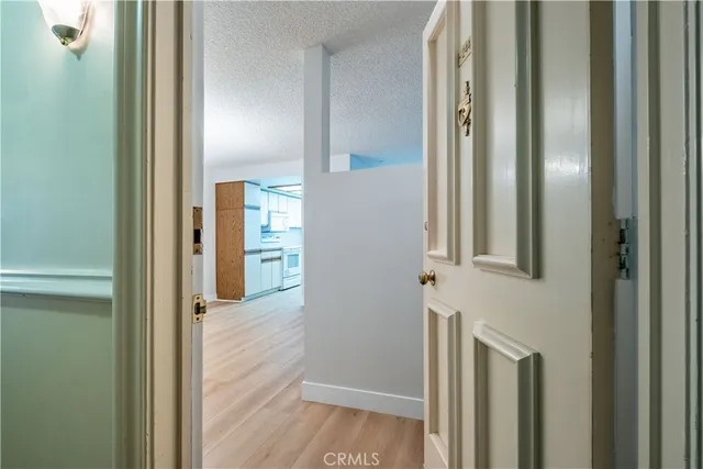 a view of a patio with table and chairs with wooden fence and plants