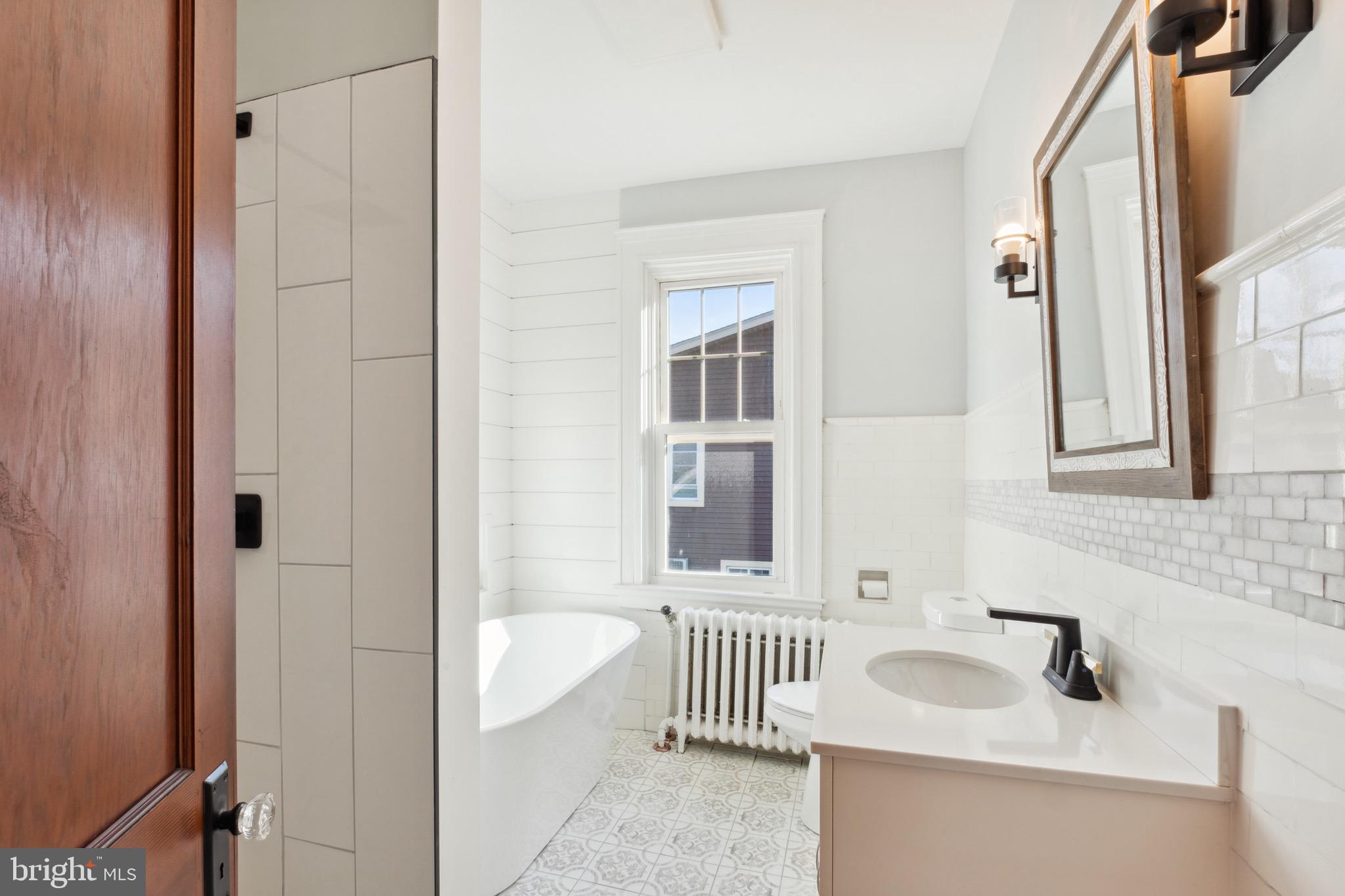222 Mallow Hill Road Baltimore, MD 21229 - Photo 28 of 47 Shared Hall Bathroom w/ Sep. Shower & Soaking Tub