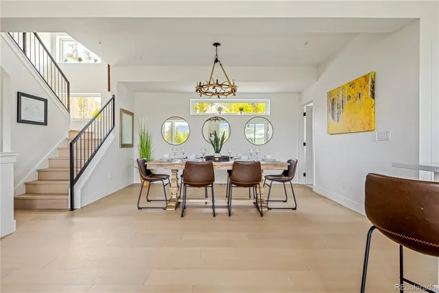 a view of a dining room with furniture and chandelier