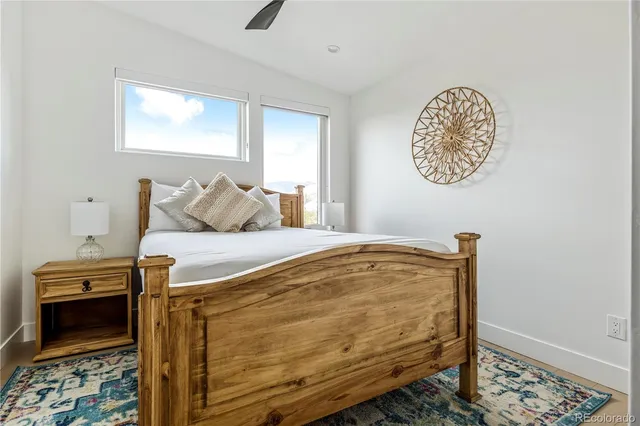 a bedroom with a bed and a table in it