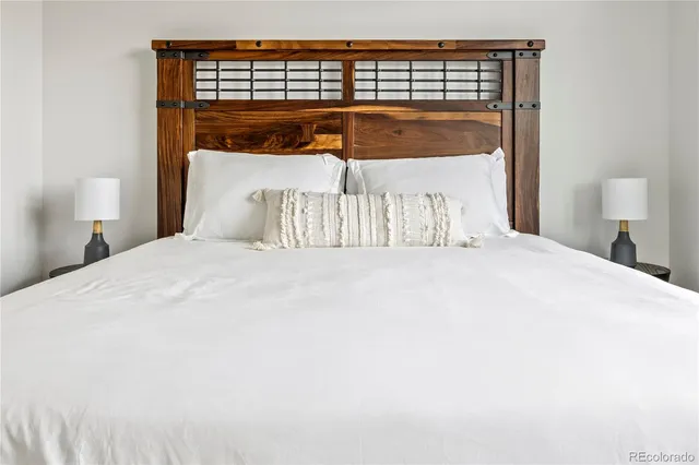 a bed sitting in a bedroom next to a walk in closet