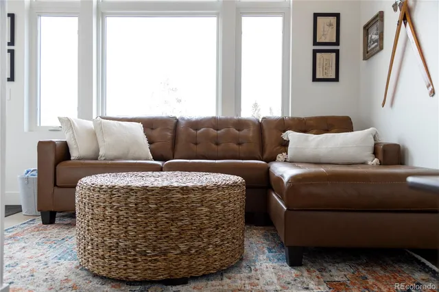 a living room with a couch and a window