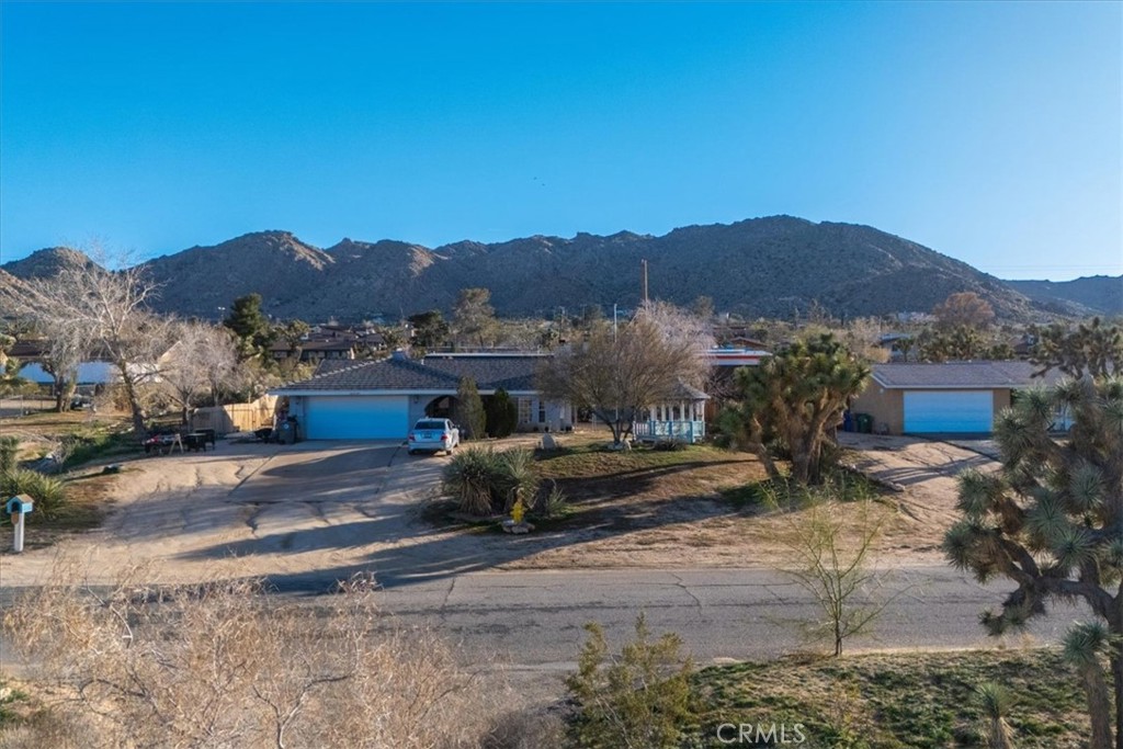 60432 Latham Trail Joshua Tree, CA 92252 - Photo 24 of 25 a view of a town with mountains in the background