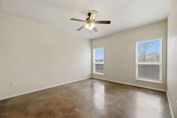 a view of kitchen and kitchen with stainless steel appliances wooden floor
