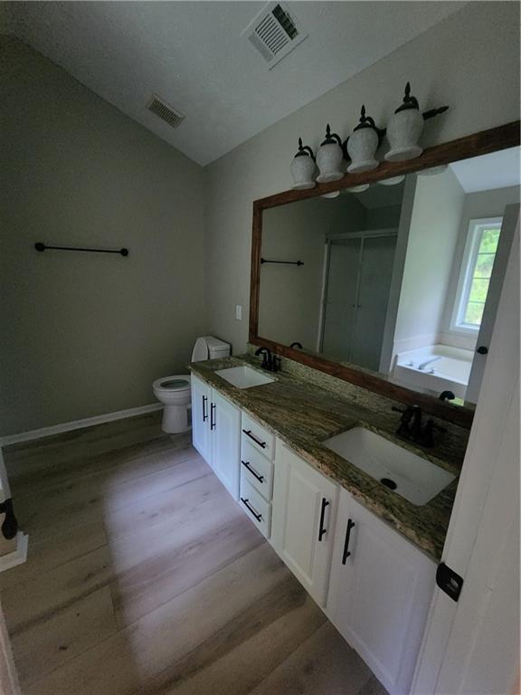 435 Butler Bridge Circle Covington, GA 30016 - Photo 9 of 25 a kitchen with a sink stove and cabinets