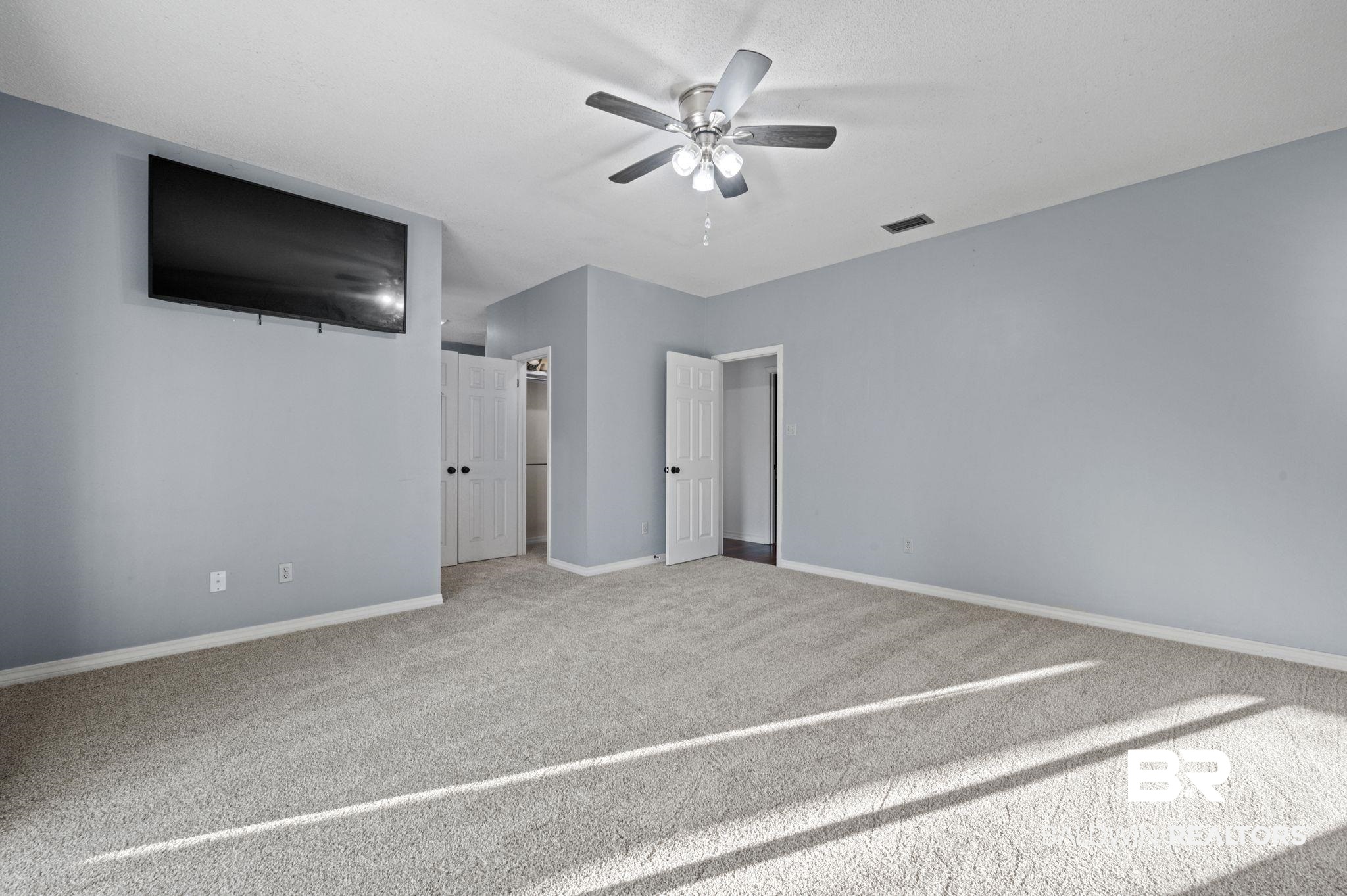 100 Orleans Way Daphne, AL 36526 - Photo 20 of 31 Unfurnished bedroom with carpet floors and ceiling fan