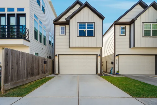 a front view of a house with garage
